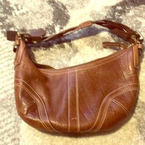 Natural brown leather coach bag.   Small